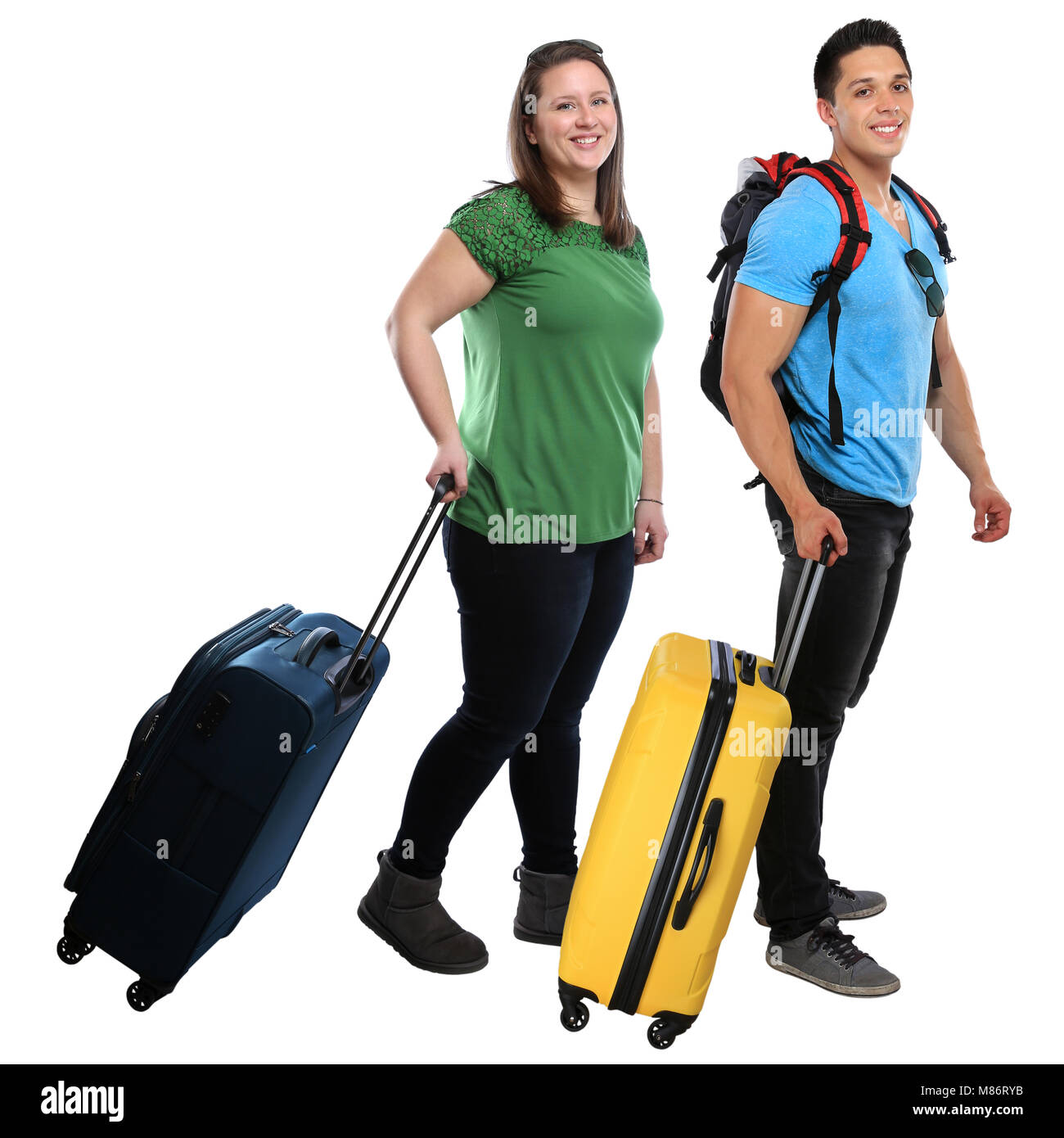 Giovani sacchetto tirando il bagaglio viaggio viaggi vacanza vacanze sorridenti isolato su uno sfondo bianco Foto Stock