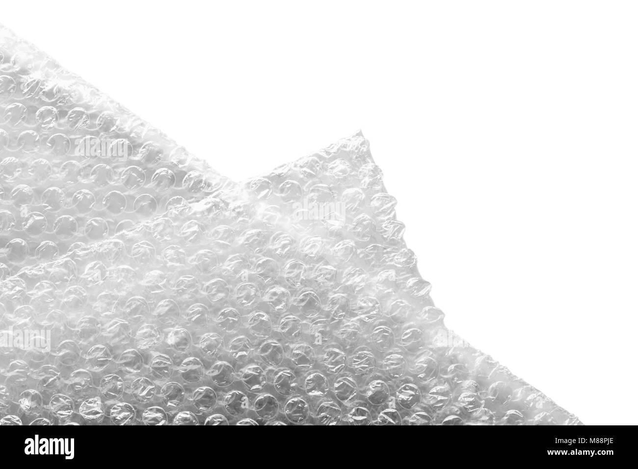 Bubble wrap materiale per un imballaggio di sicurezza, isolato su sfondo bianco. Texture astratta. Foto Stock