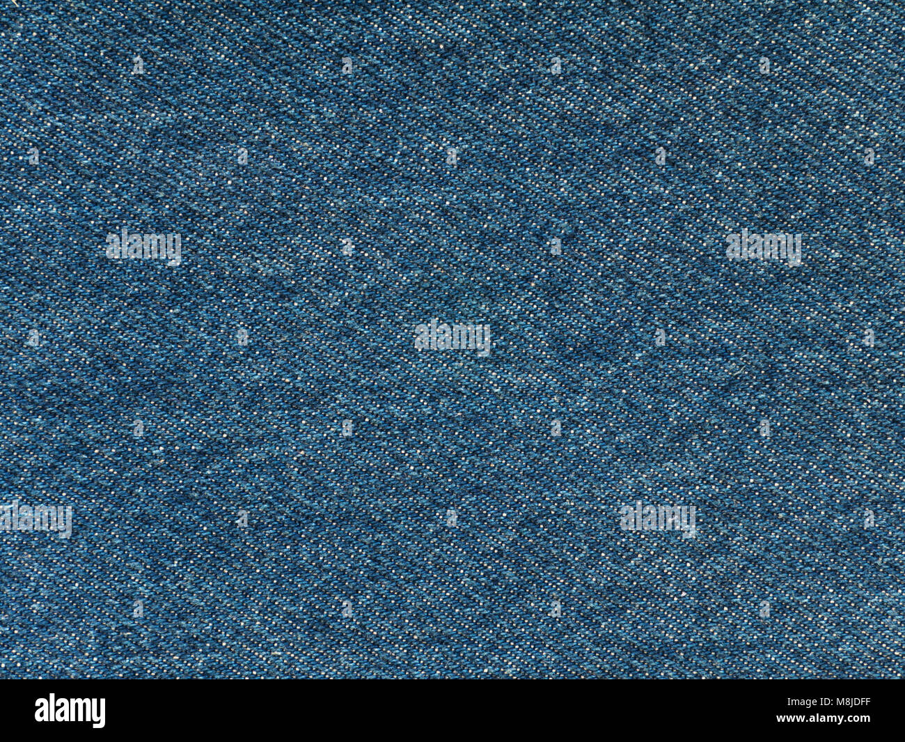 Di medie blu lavato di tessuto denim texture swatch Foto Stock