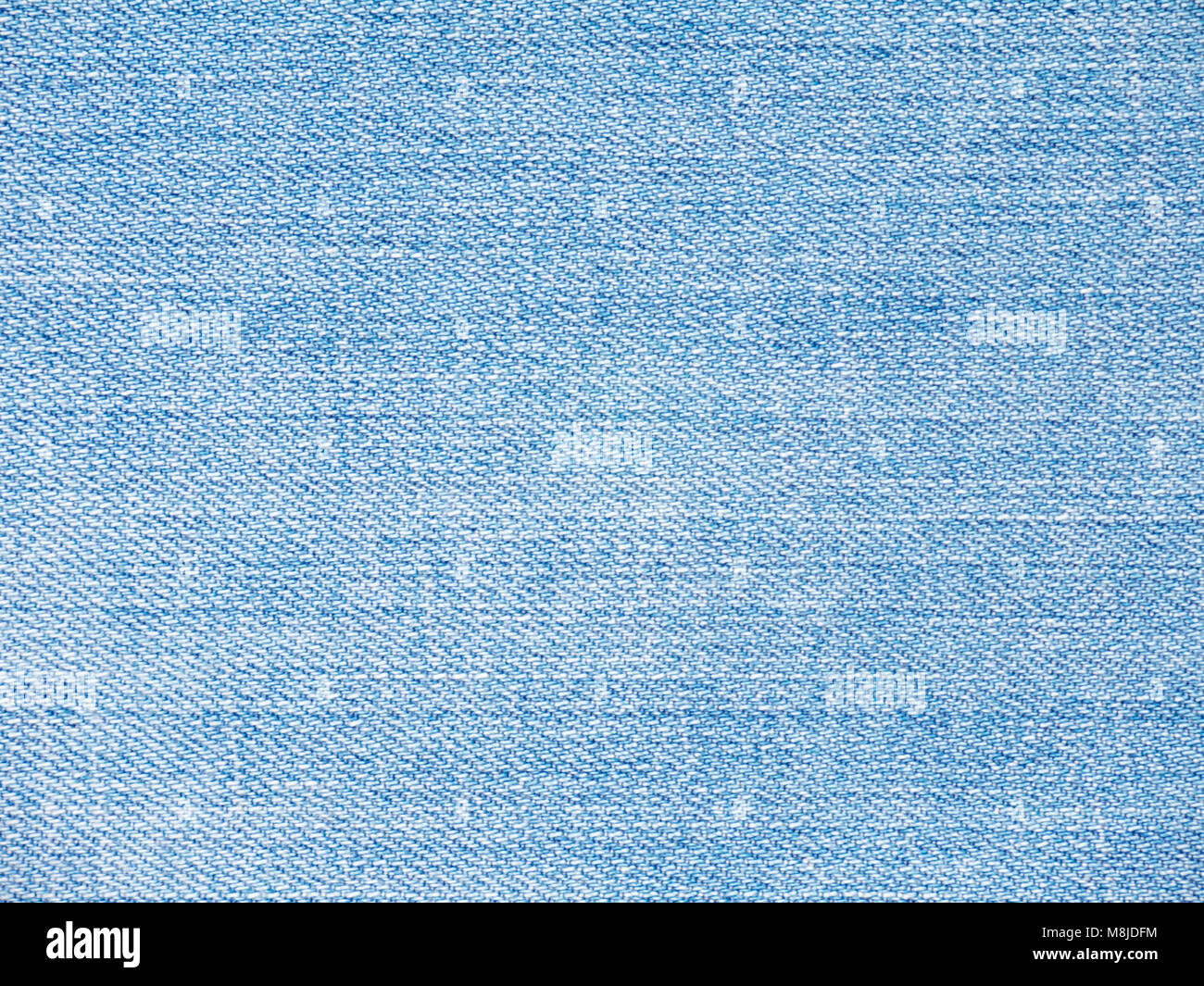 Luce blu lavato sbiadito di tessuto denim texture swatch Foto Stock