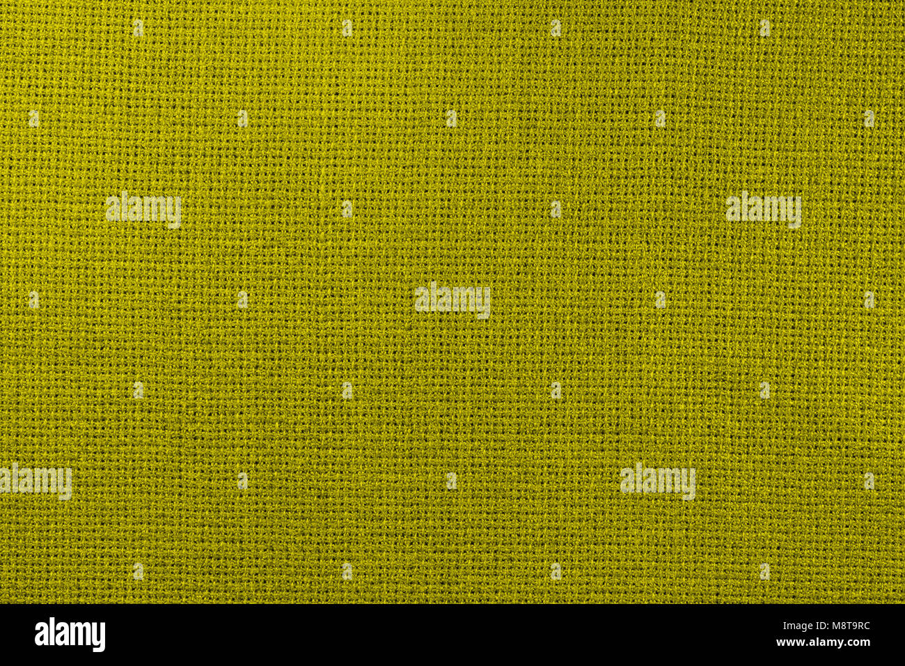 In lino naturale di tessuto per ricamo. Tonificazione in pantone colour  golden lime Foto stock - Alamy