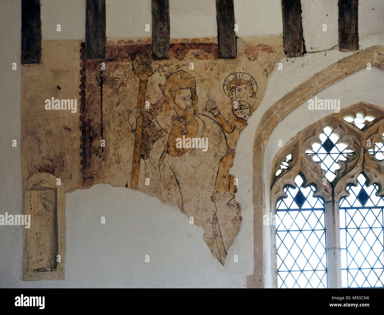 Chiesa Edingthorpe, Norfolk ha rari del XIV secolo dipinti su navata settentrionale parete. Questa mostra St Christopher. Foto Stock
