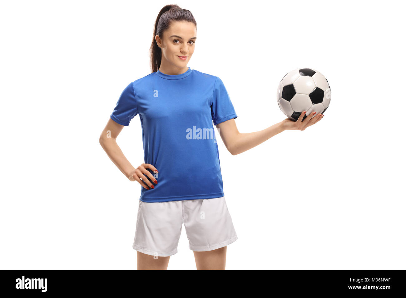 Calcio femminile player tenendo un calcio isolati su sfondo bianco Foto Stock