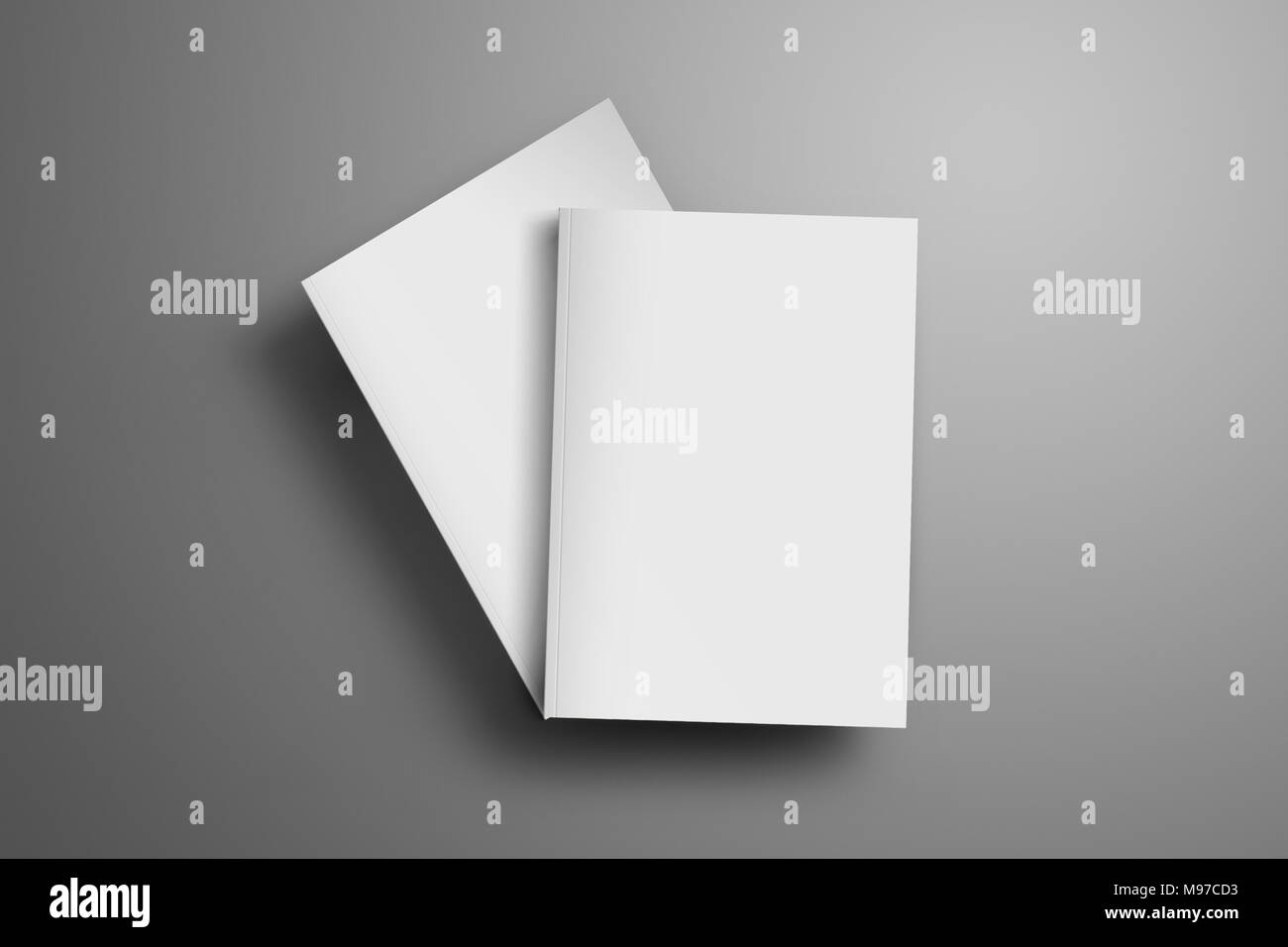 Due vuoto chiuso A4, (A5) riviste con morbide ombre realistiche isolato su sfondo grigio. Uno degli opuscoli si trova in corrispondenza di un angolo della seconda broch Foto Stock