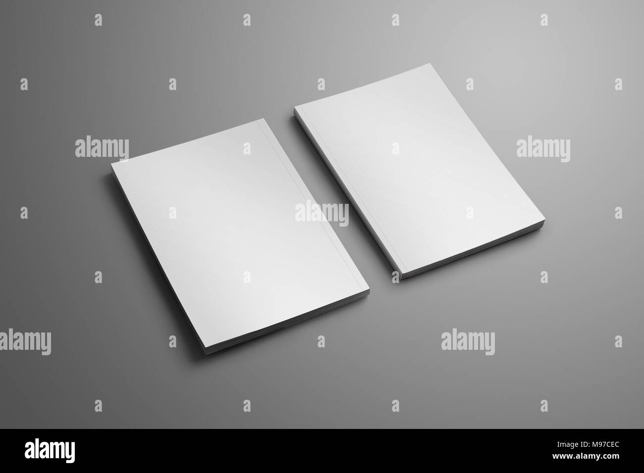 Due eleganti vuoto chiuso A4, (A5) brochure con morbide ombre realistiche isolato su sfondo grigio. Un modello può essere utilizzato per la tua vetrina. Foto Stock