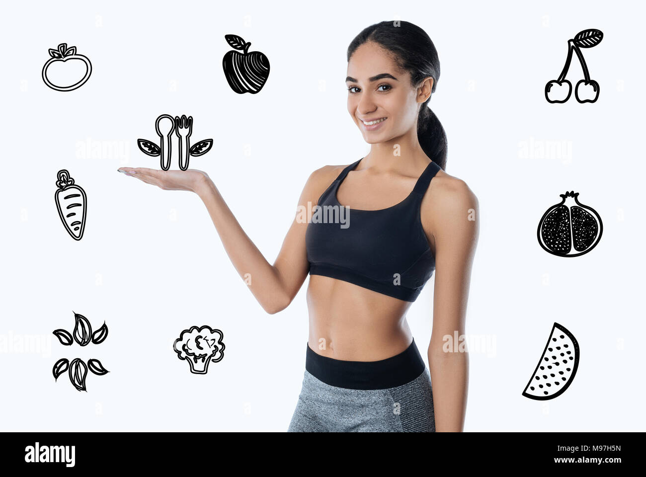 Sporty giovane donna mantenersi in forma e mangiare cibo sano Foto Stock