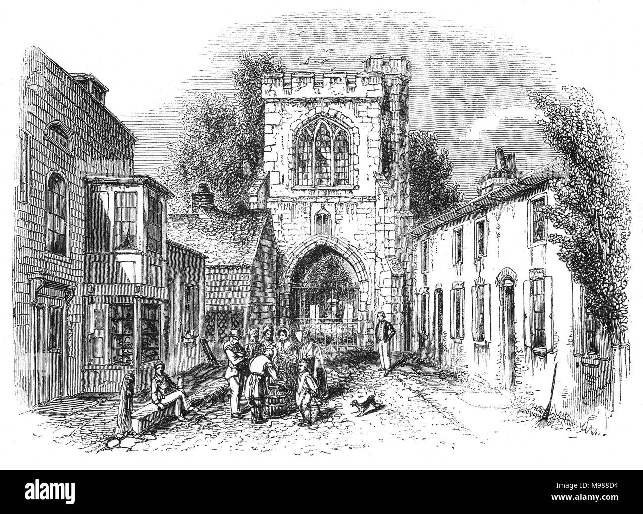La campana antincendio (Gate e coprifuoco) probabilmente costruita nel tempo della Badessa Felton è menzionato per la prima volta nel 1400. Essa era parte di Barking Abbey, un monastero benedettino fondato nel c666 e chiuso nel 1539 come parte della dissoluzione. Il gateway è anche conosciuta come la Torre di coprifuoco o cimitero cancello quando divenne più tardi l'ingresso al sagrato della chiesa parrocchiale. Barking, Essex, Inghilterra Foto Stock