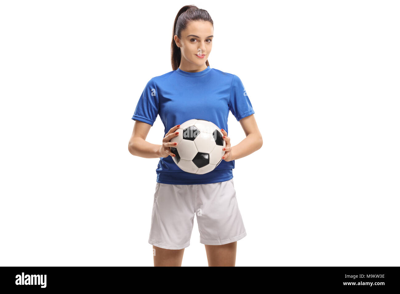 Calcio femminile player tenendo un calcio isolati su sfondo bianco Foto Stock