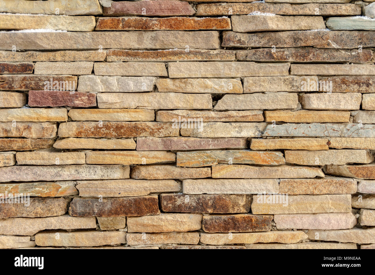 In mattoni di pietra arenaria muro di pietra sfondo texture Foto Stock