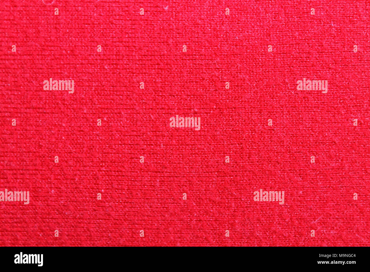Tessuto colorato di rosso la texture o uno sfondo Foto Stock