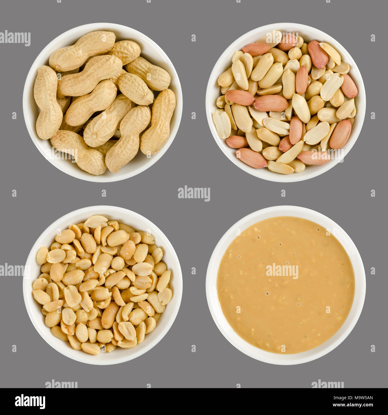 Arachidi in porcellana bianca bocce. Arrosto di Arachidi in guscio, sgusciate, salato e croccante e burro di arachidi. Snack e diffusione. Arachis hypogaea. Foto Stock
