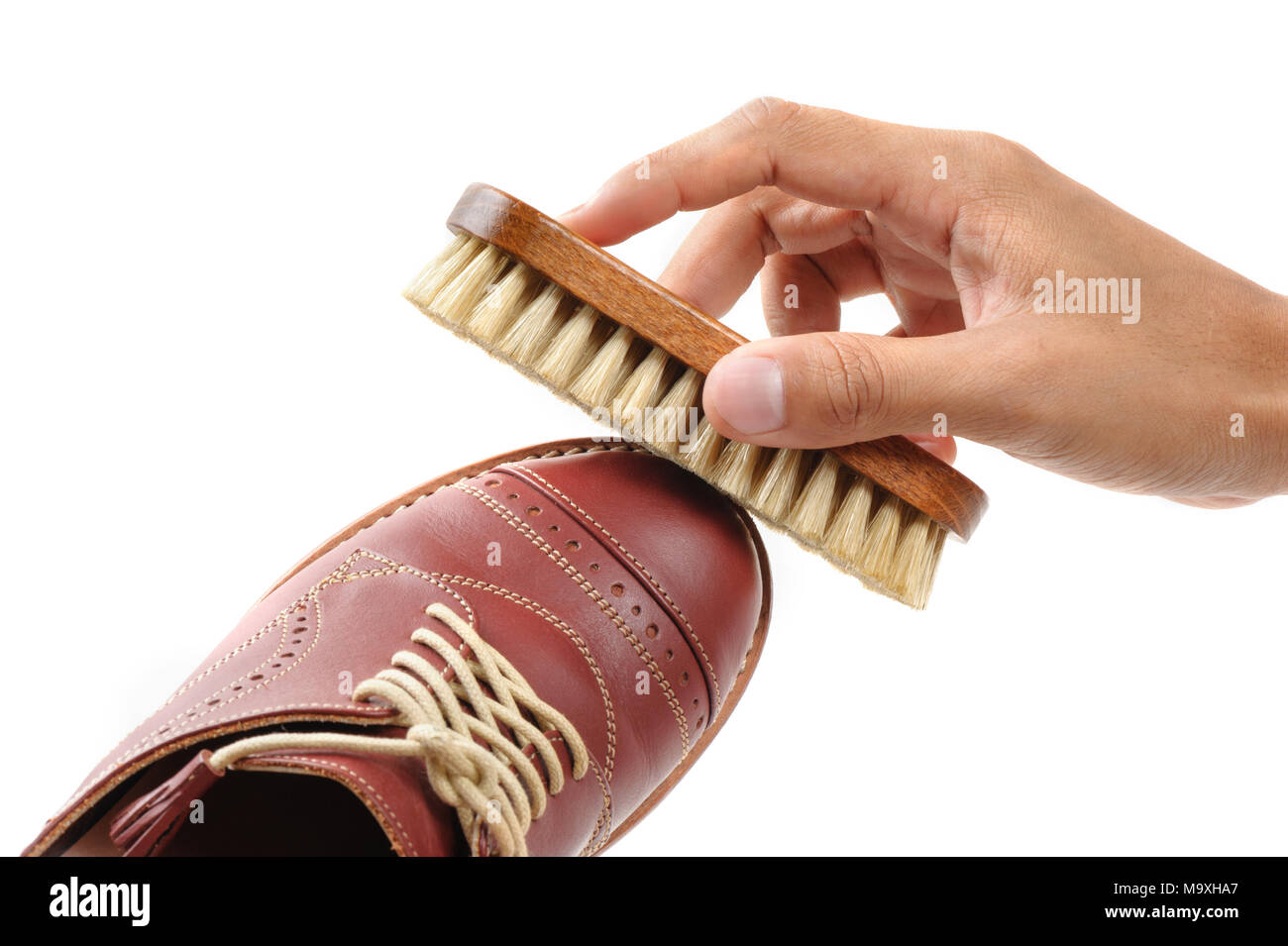 La spazzola di crine per scarpe in cuoio di lucidatura. Foto Stock