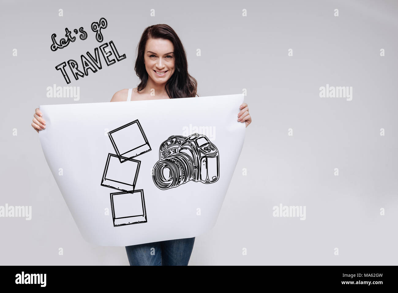 Positivo persona giovane sorridente e desiderosi di viaggiare in tutto il mondo Foto Stock