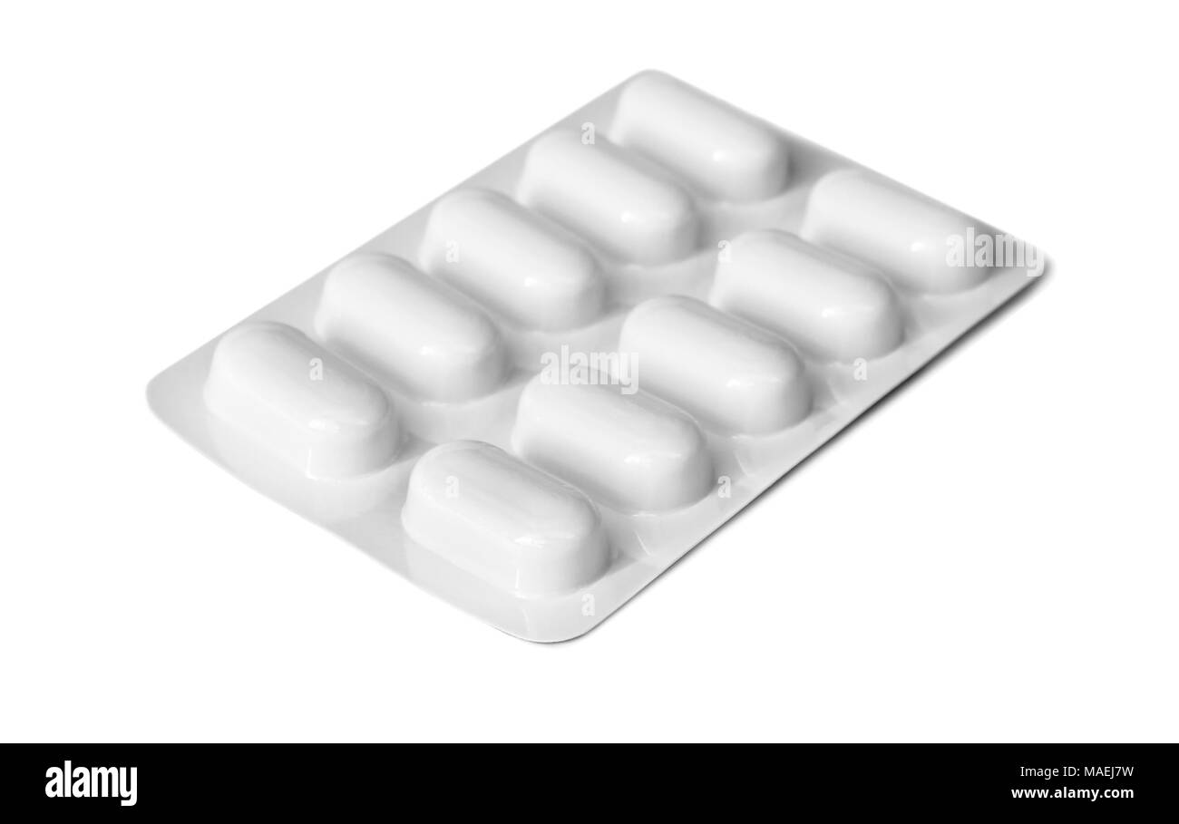 Pillole di medici in una piastra di plastica isolati su sfondo bianco Foto Stock