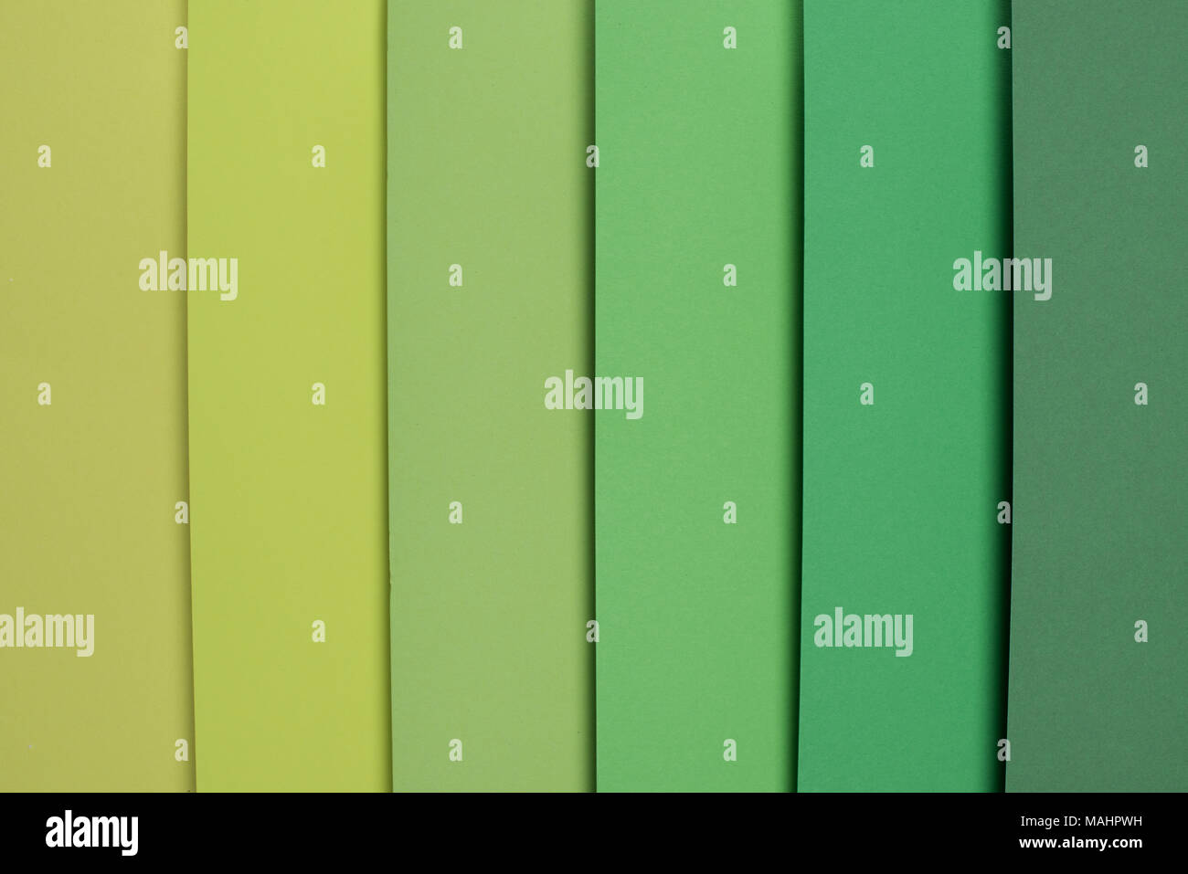 Verde pastello e di colore verde chiaro su sfondo a strisce Foto stock -  Alamy