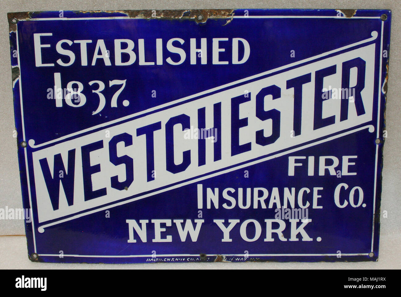 Acciaio smaltato scambi segno per Westchester Fire Insurance Company di New York con sfondo blu e scritte bianche Titolo: Commercio segno da Westchester Fire Insurance Company di New York . dopo il 1870. Foto Stock