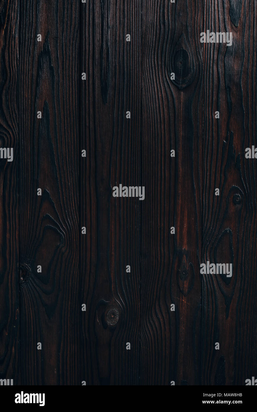 Vista ravvicinata del fustellato scuro dello sfondo in legno Foto Stock