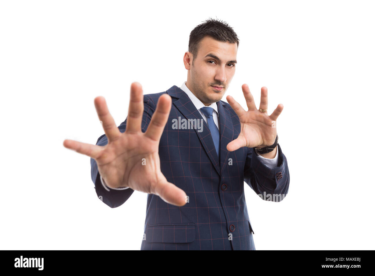 Giovane imprenditore o vendite uomo con gesti difensivi come schermatura o di rigetto concetto isolato su sfondo bianco Foto Stock