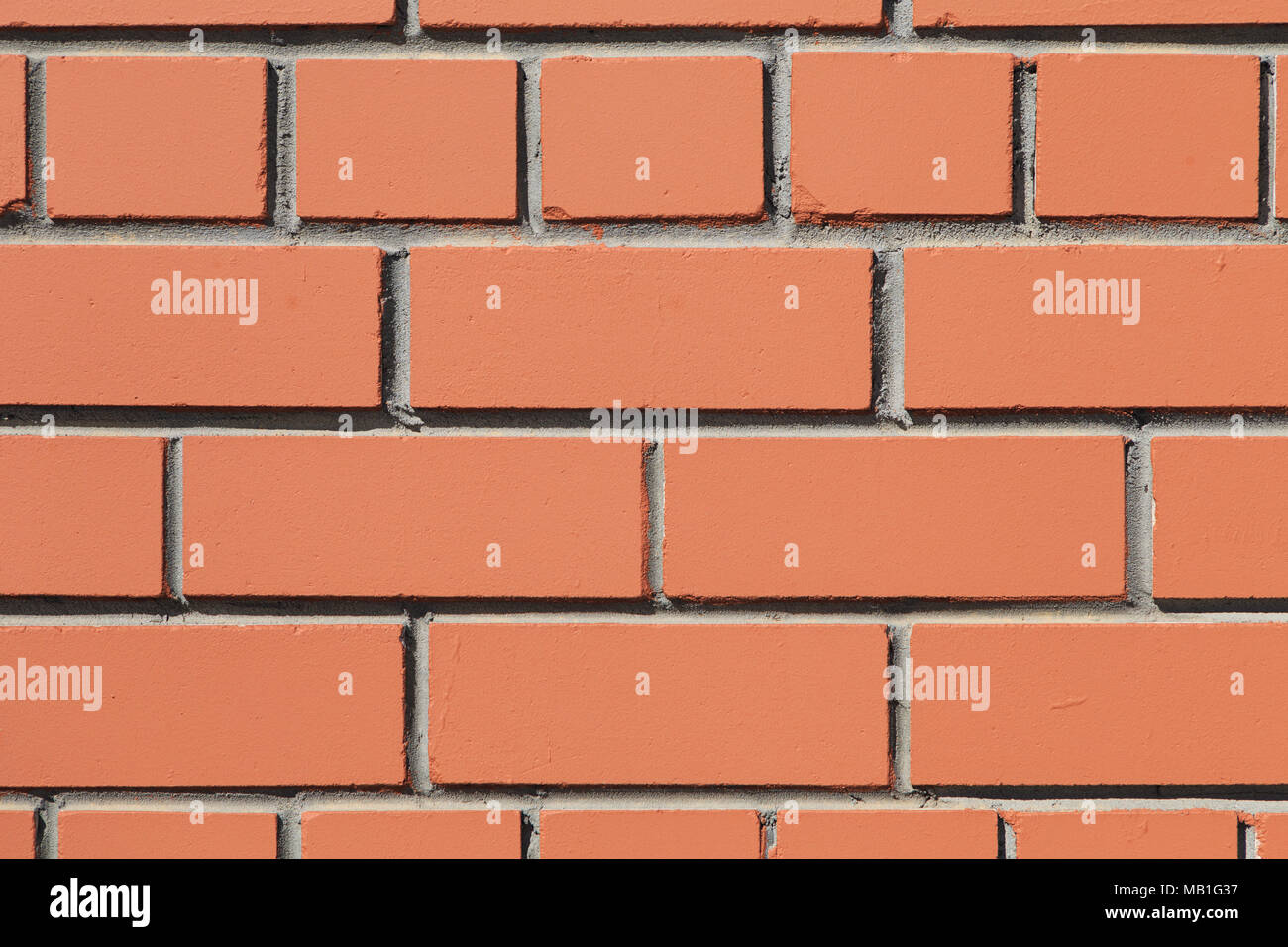 Parte anteriore vista ravvicinata di una superficie piana di un muro di mattoni con i mattoni simmetricamente sparso Foto Stock