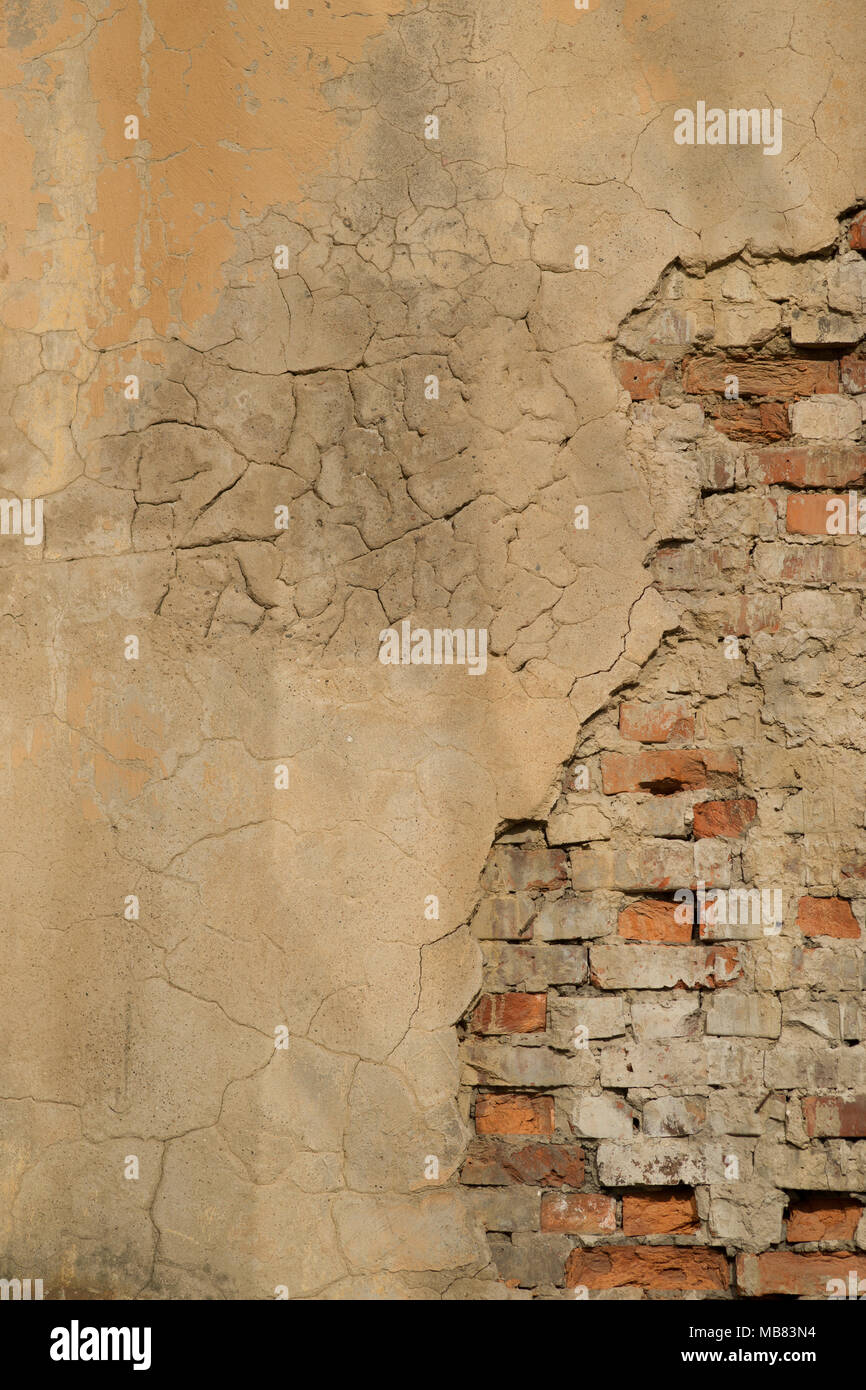 Calcestruzzo incrinato vintage muro di mattoni in background Foto Stock