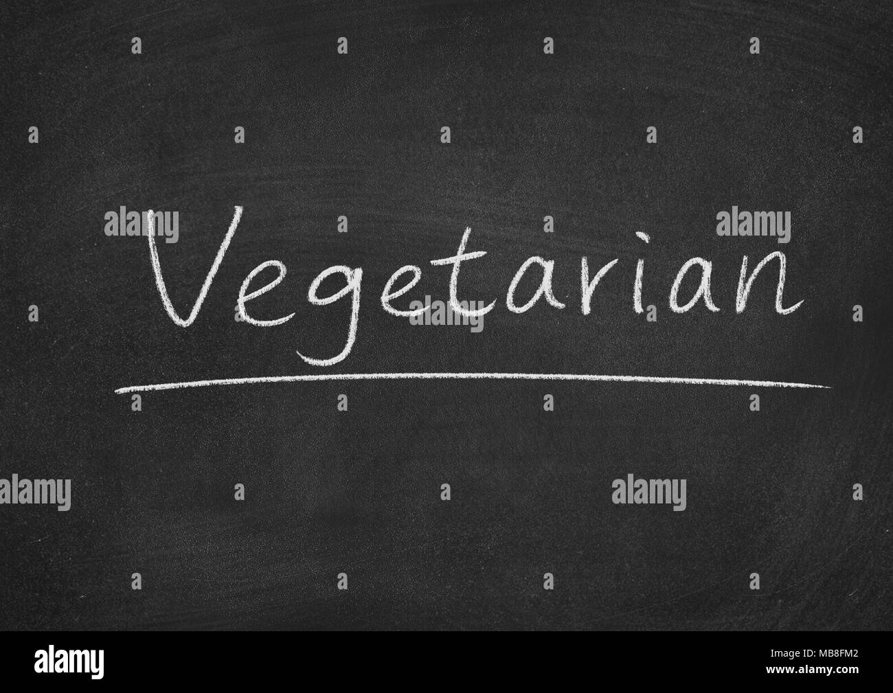 Concetto vegetariano parola su una lavagna sfondo Foto Stock