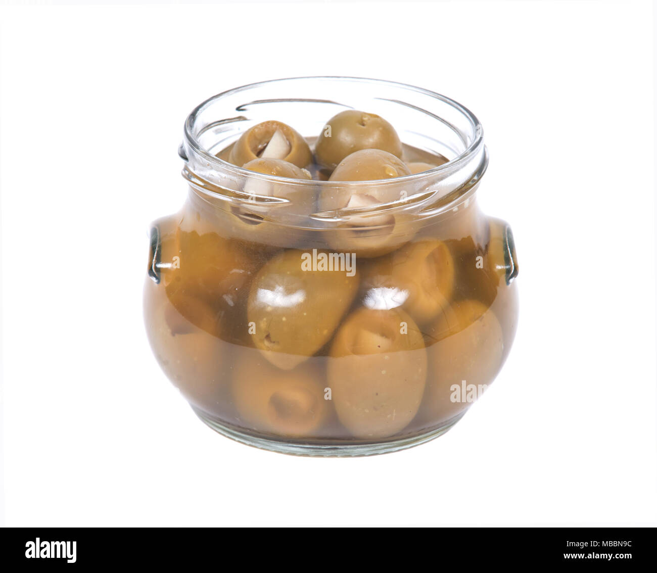 Green colossale mano Olive ripiene con Aglio guanti in vaso Foto Stock