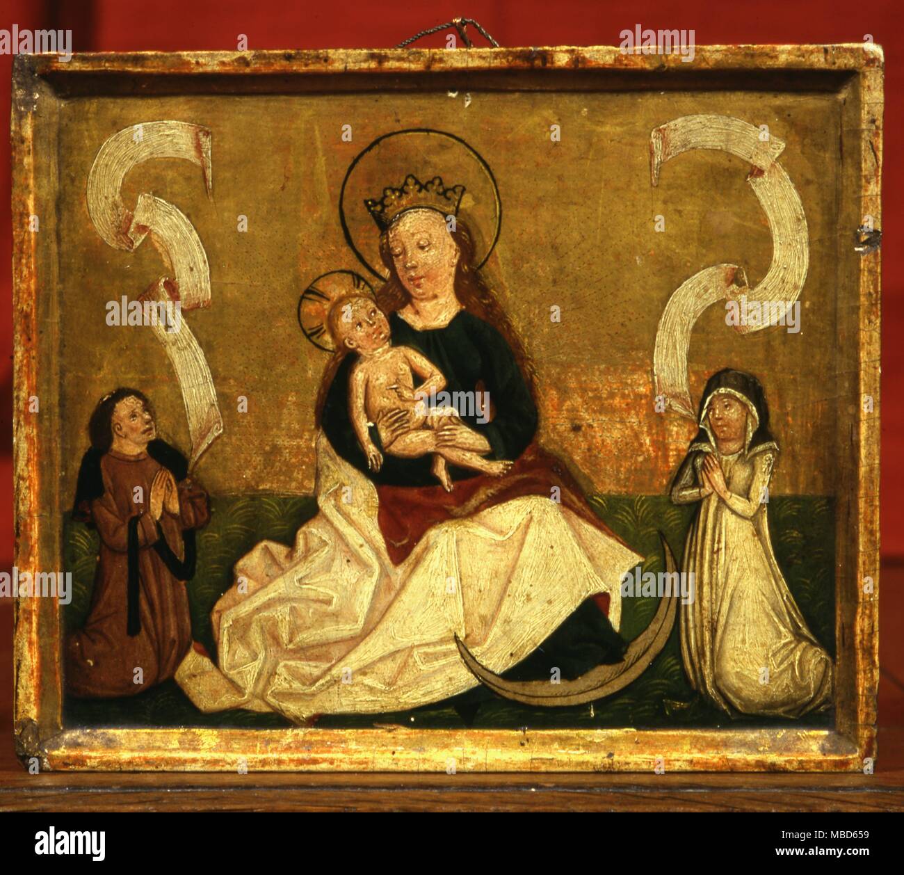 Il simbolo - Crescent Crescent Moon ai piedi di Maria si rifà al suo collegamento con con l'Egiziano dea lunare, Isis. Anonimo del XIII secolo il pannello nella Huis Bergh Raccolta . Foto Stock