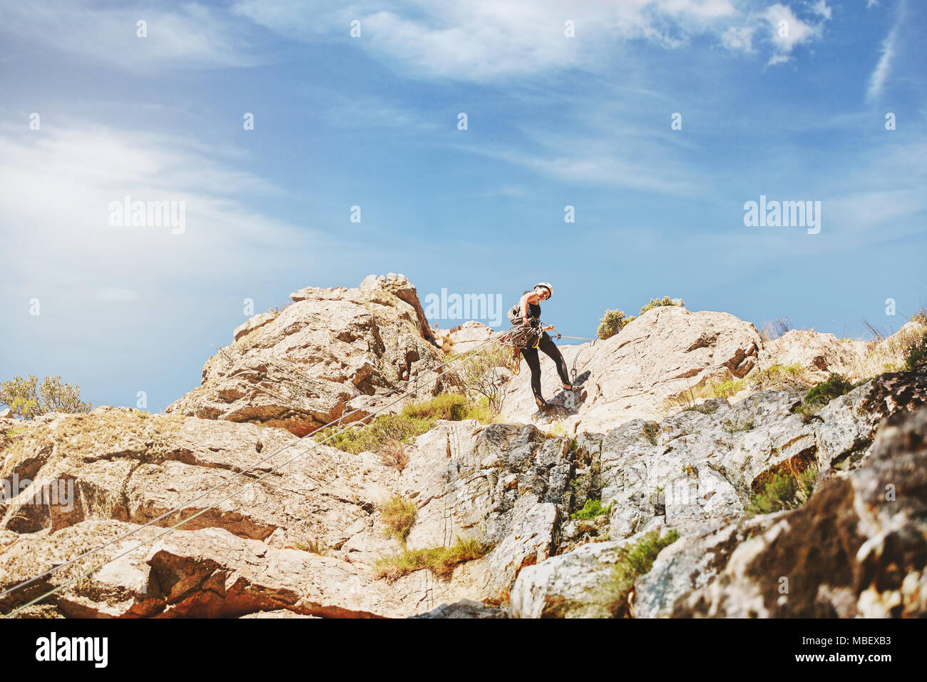 Scalatore di rocce di arrampicata Foto Stock