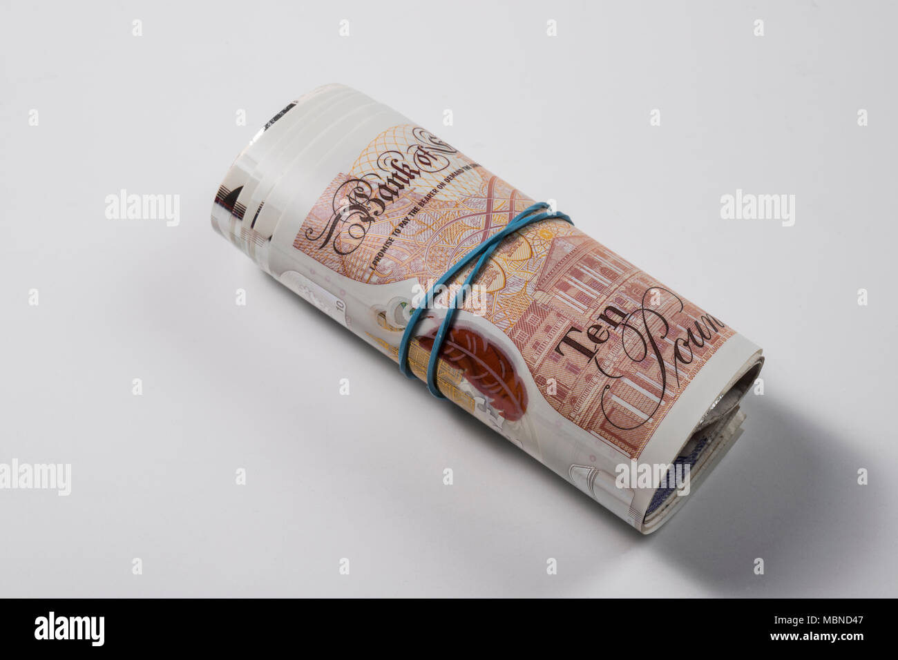Un rotolo di UK £ 10,00 note Foto Stock