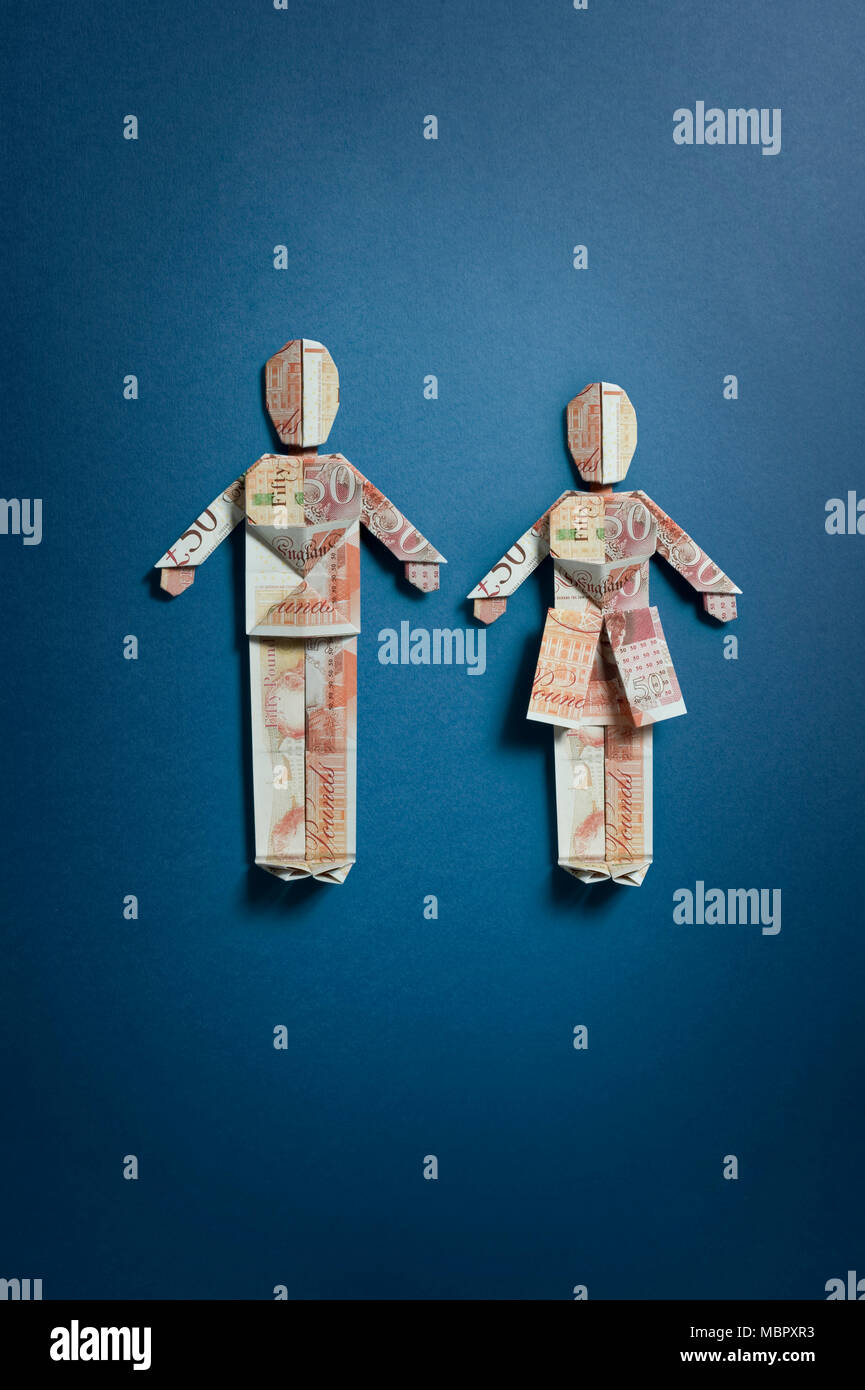 Due cinquanta pound note piegati nella forma di un uomo e di una donna Foto Stock