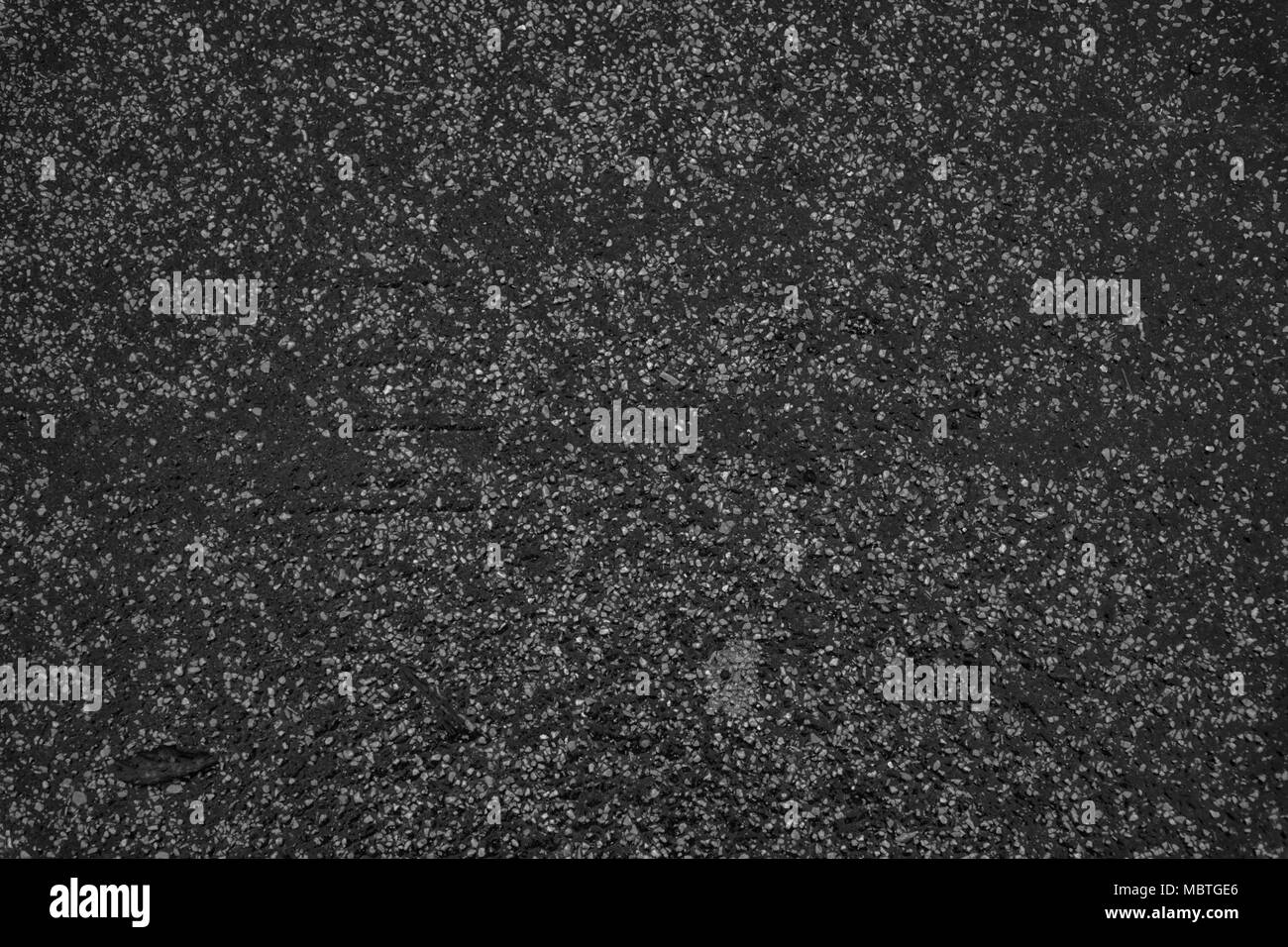 Texture monocromatica di nero pavimento in gomma sul parco giochi. ( Etilene Propilene Diene Monomeror EPDM) Foto Stock