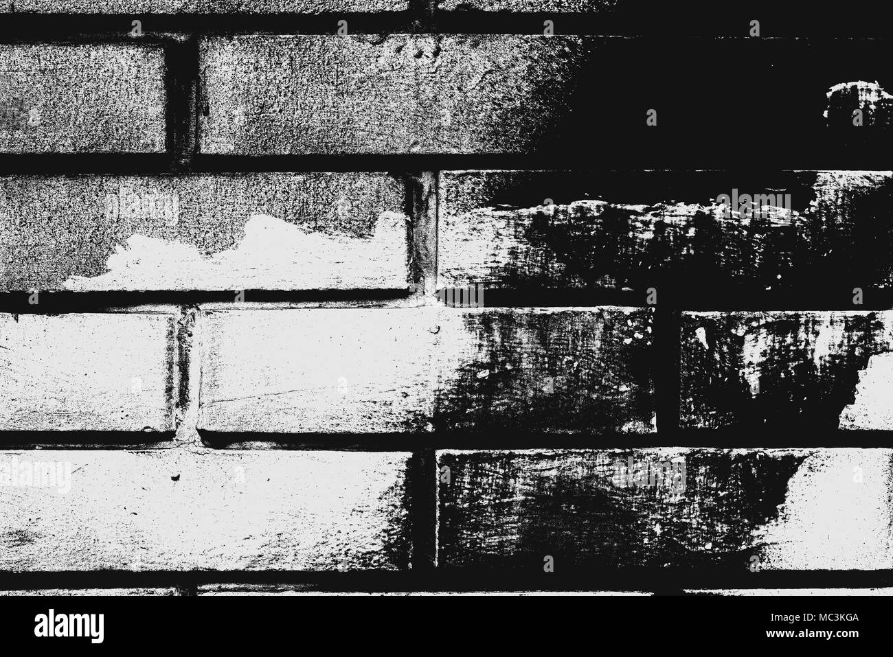 In bianco e nero un muro di mattoni pattern come sfondo. Texture di mattoni con effetti soglia come elemento di design. Foto Stock