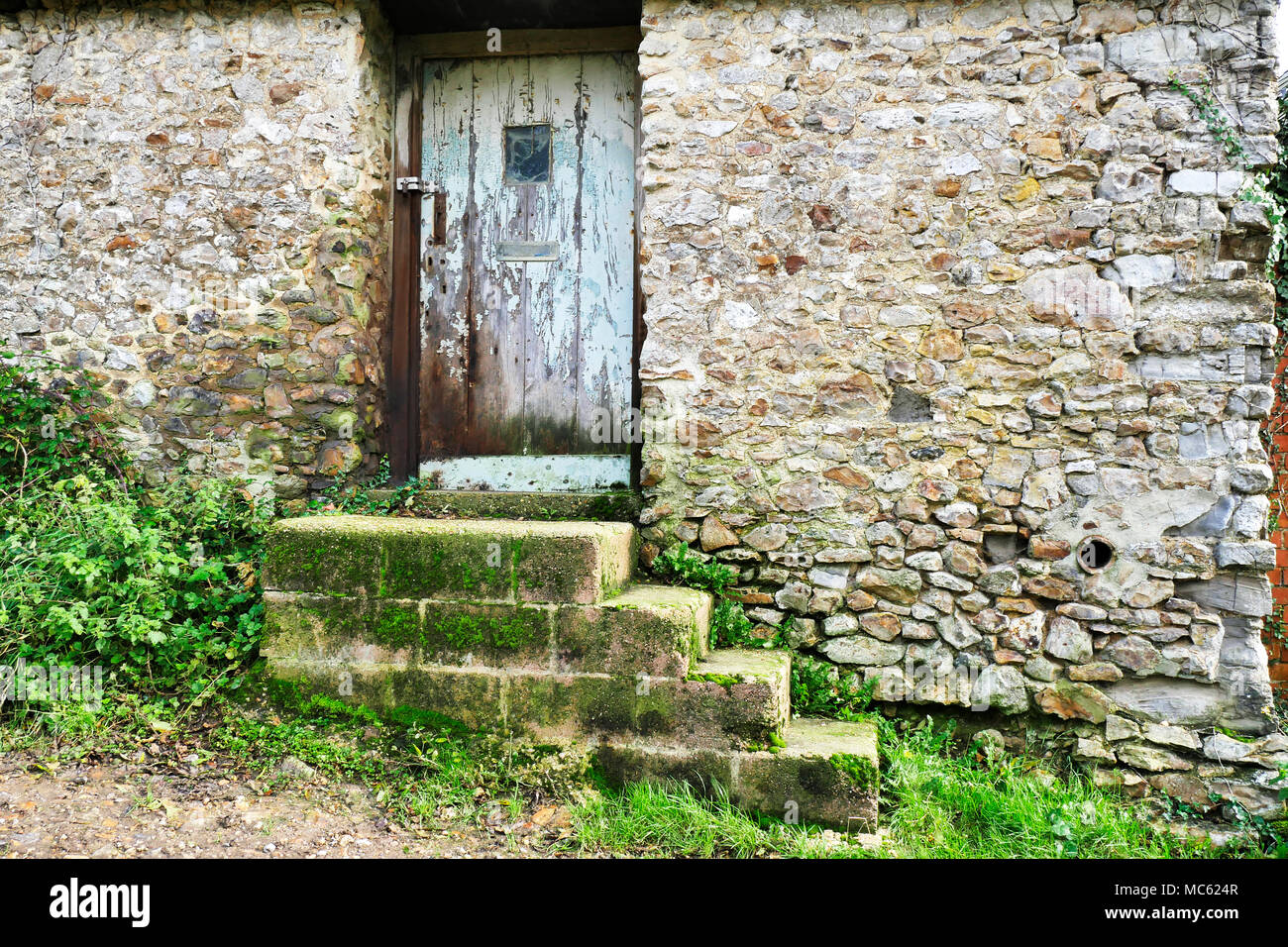 Un vecchio fienile in pietra nella campagna di Dorset. Foto Stock