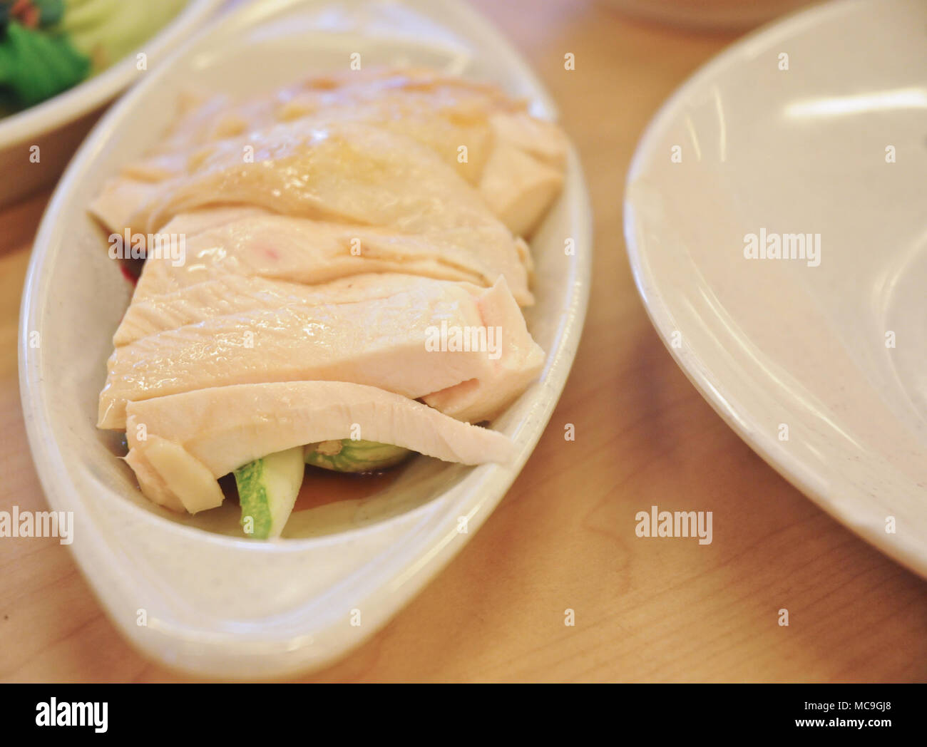 Deliziosa leggendario Hainanese Singapore riso al pollo con due toni di salsa di immersione Foto Stock