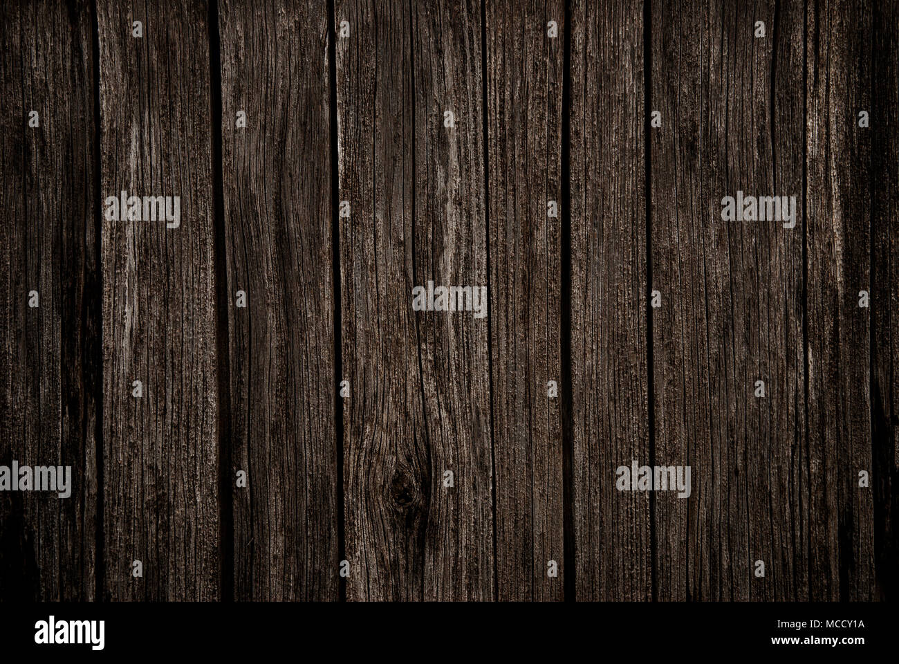 Il vecchio ricco legno scuro grano sfondo texture con nodi. Foto Stock