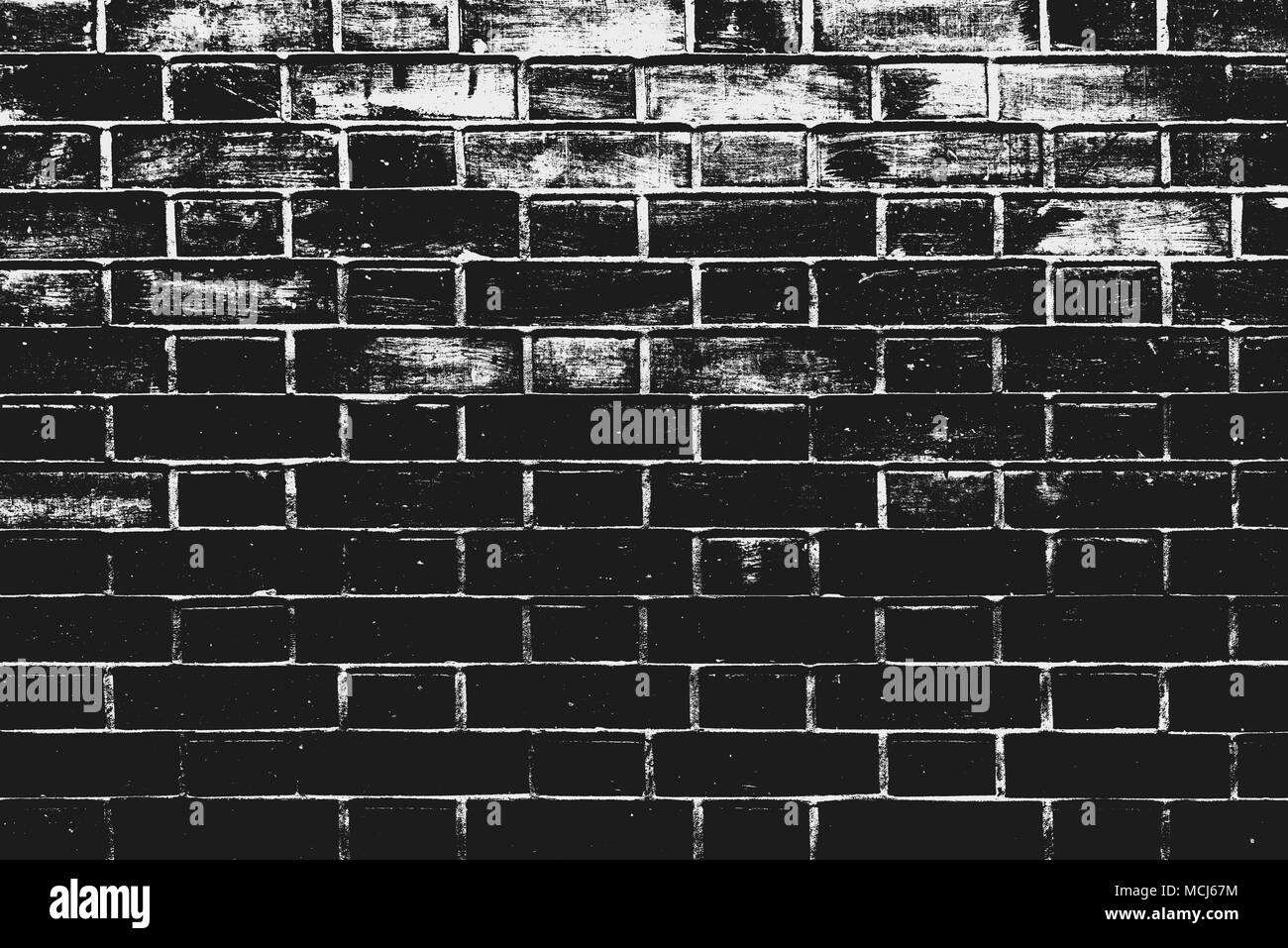 In bianco e nero un muro di mattoni pattern come sfondo. Texture di mattoni con effetti soglia come elemento di design. Foto Stock