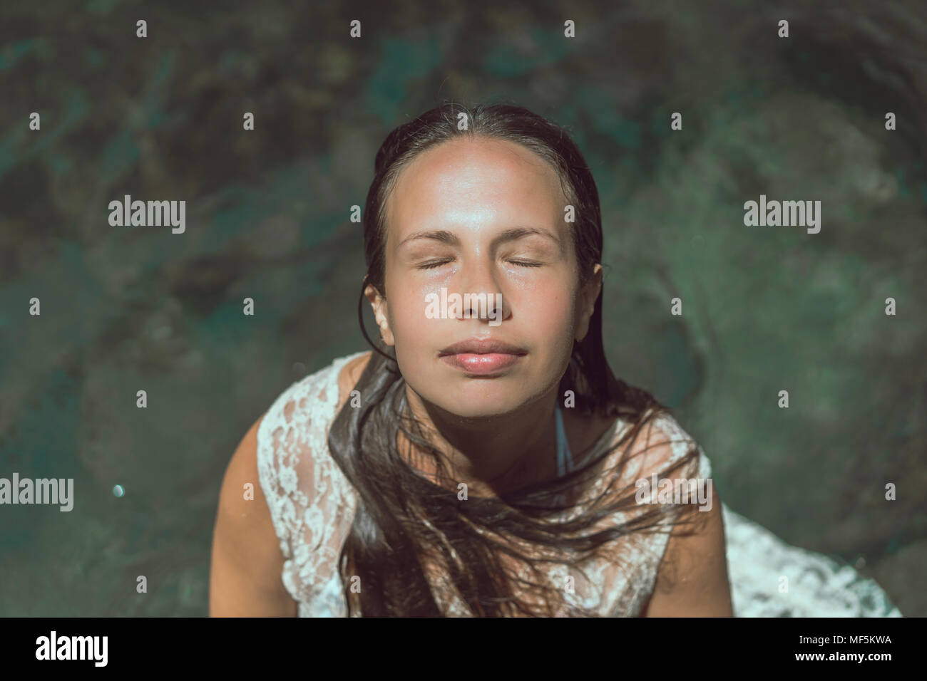 Laos, Donna con gli occhi chiusi Foto Stock