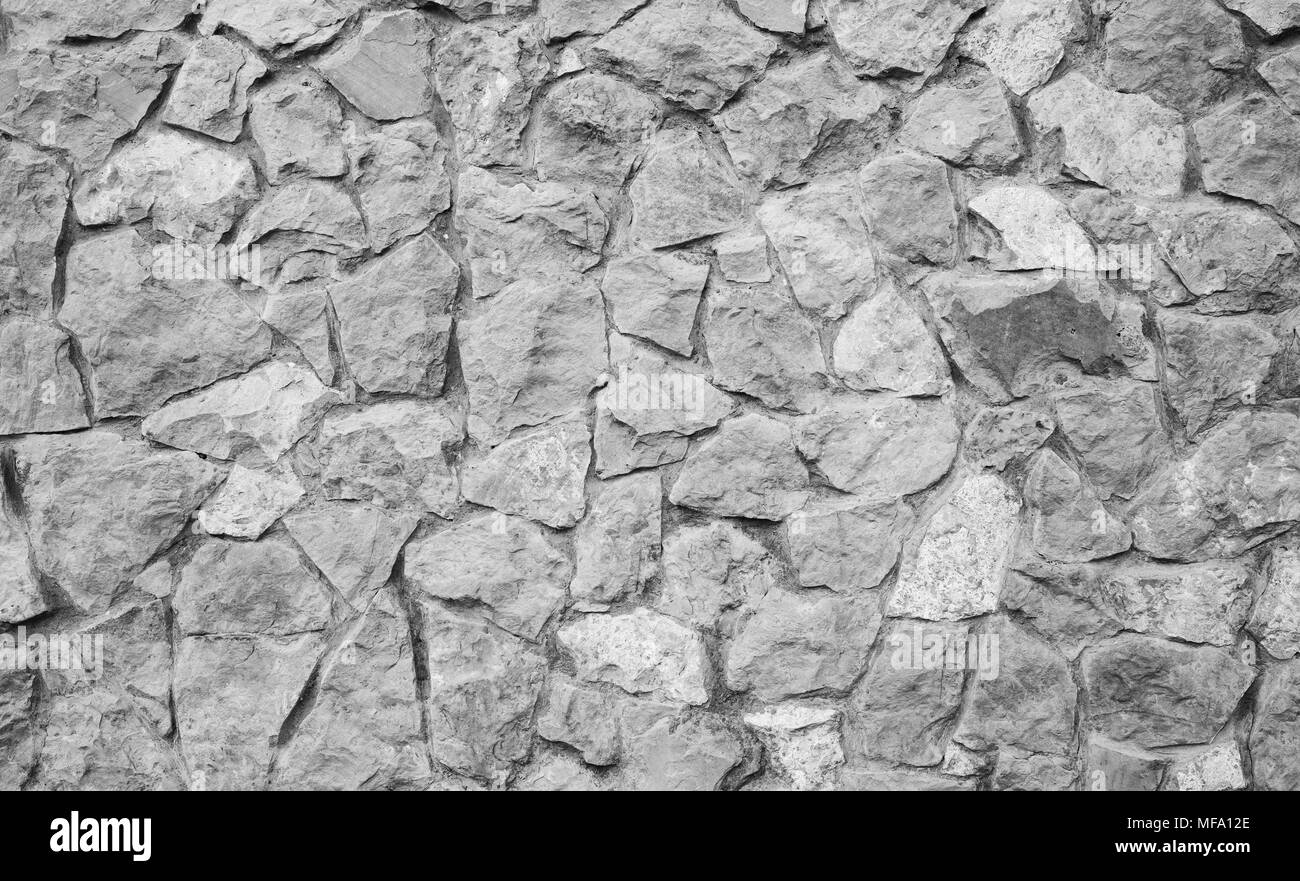Grigio pietra texture, road. Naturale antica strada acciottolata come sfondo. Foto Stock
