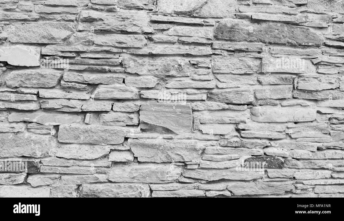 Alta qualità di pietra grigia parete texture. Naturale antica strada acciottolata come sfondo. Foto Stock
