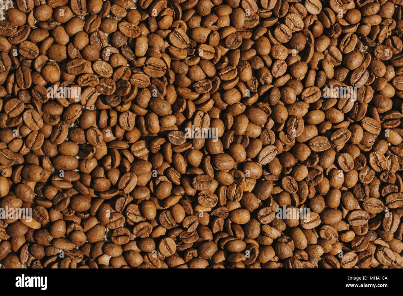 Close-up Brown chicco di caffè sfondo.bevande calde texture. Foto Stock