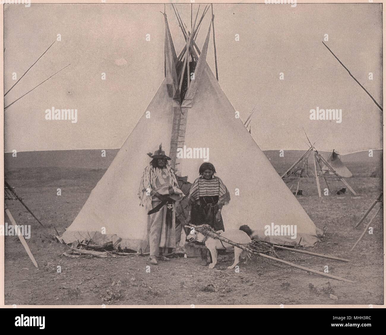 Bull capo indiano, Squaw e cane nel cavo elettrico Foto Stock