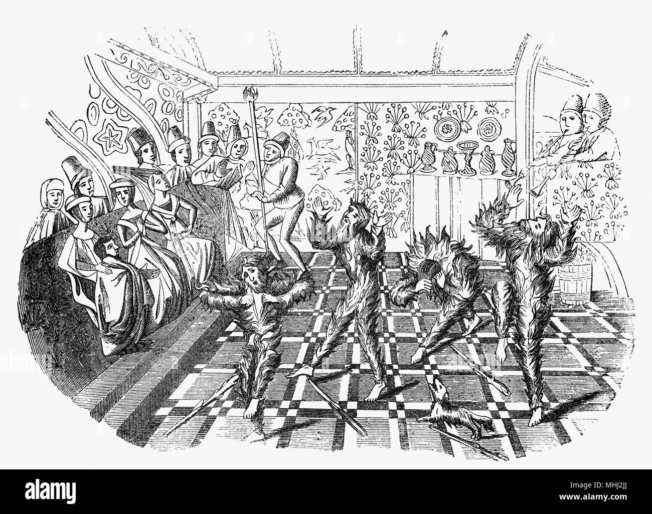 Sebbene mumming scaturiva dalle classi inferiori, Corte Mummers può essere fatta risalire almeno al 1296, quando i festeggiamenti per il matrimonio di Edward Ho la figlia a Natale incluso 'mummers della corte' lungo con 'fiddlers e giullari". In questa illustrazione da Froissart di cronache uno di un gruppo di mummers dissimulata come wild-uomini è stato bruciato a morte per incidente, durante le celebrazioni del matrimonio in Hotel St Pol a Parigi nel 1393 Foto Stock