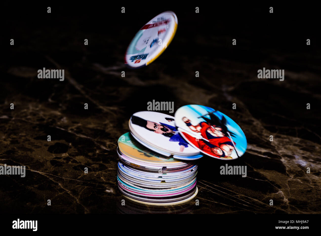 POGS colorate di vari personaggi dei cartoni animati Foto Stock