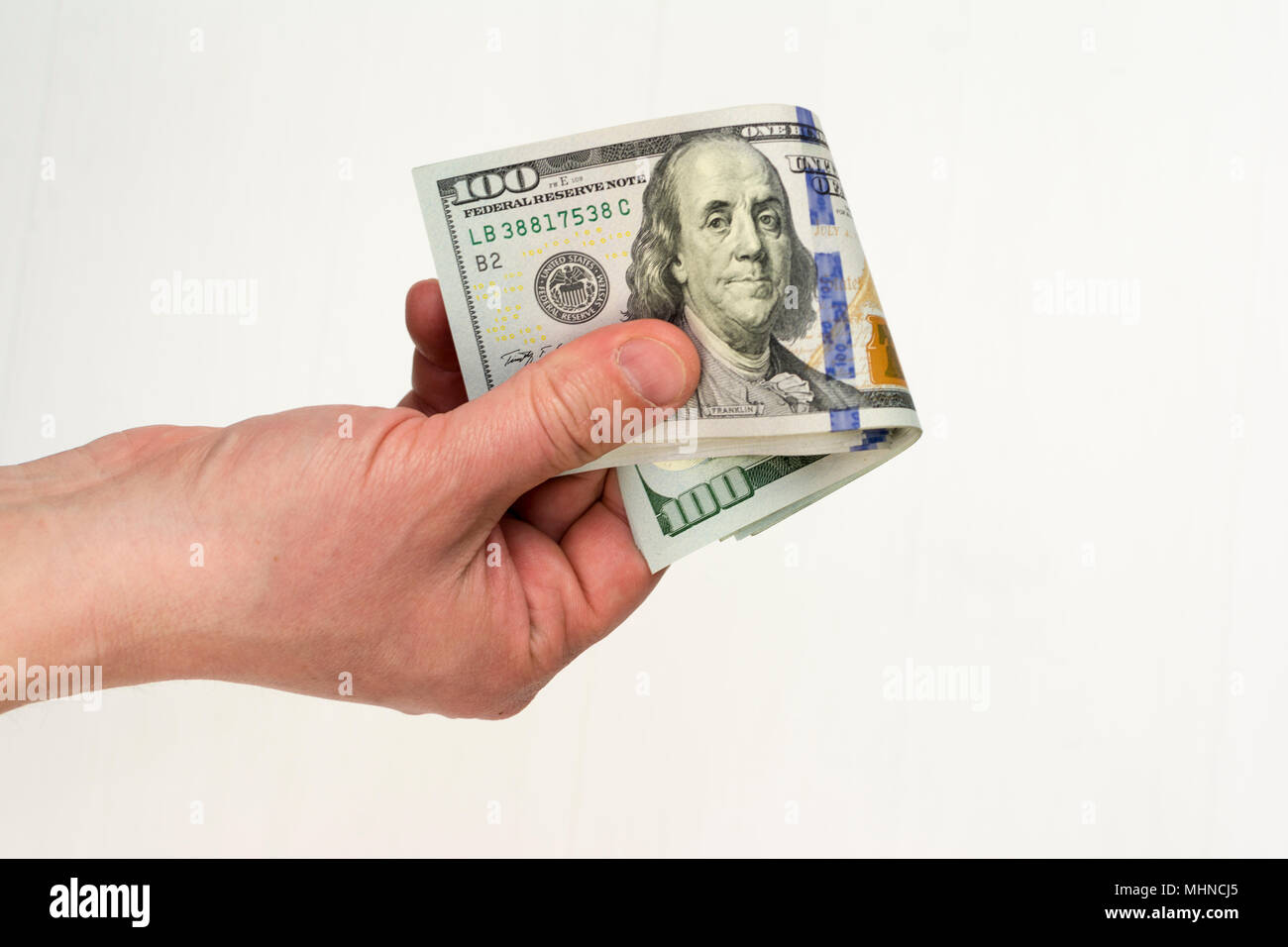 Banche dollaro nota denaro in mano Foto Stock