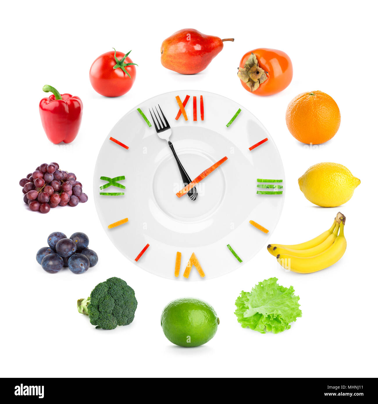 Orologio alimentare con frutta e verdura. Cibo sano concetto Foto Stock