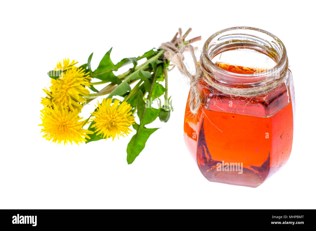 Piante medicinali, Tarassaco, fiori, il miele nel vasetto di vetro. Foto Studio Foto Stock