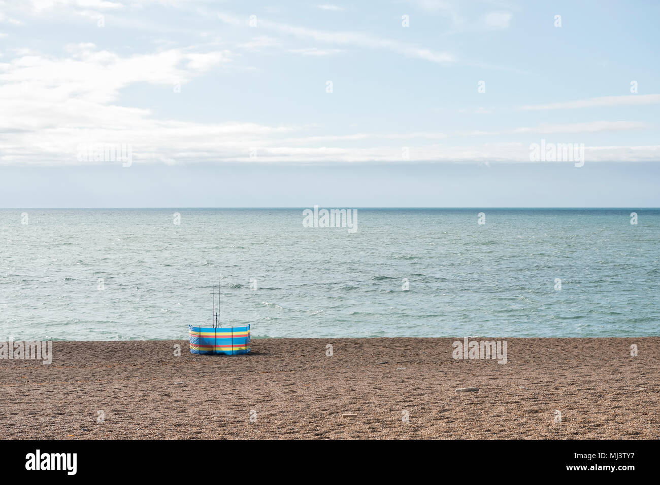 Giacca a vento sulla spiaggia Foto Stock