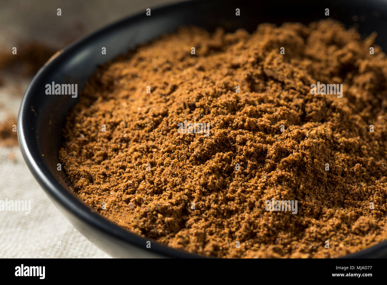 Organici di Garam Masala Indian Spice in una ciotola Foto Stock