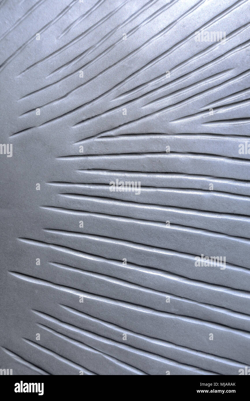 Argento piastra in metallo con scanalature Foto Stock