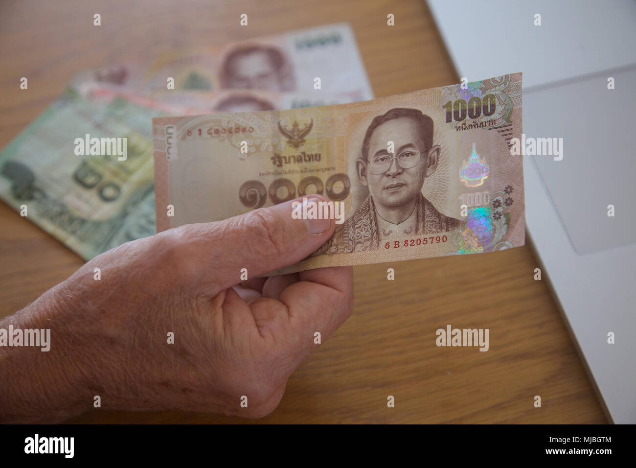 Close up di un Thai baht 1000 nota. Foto Stock